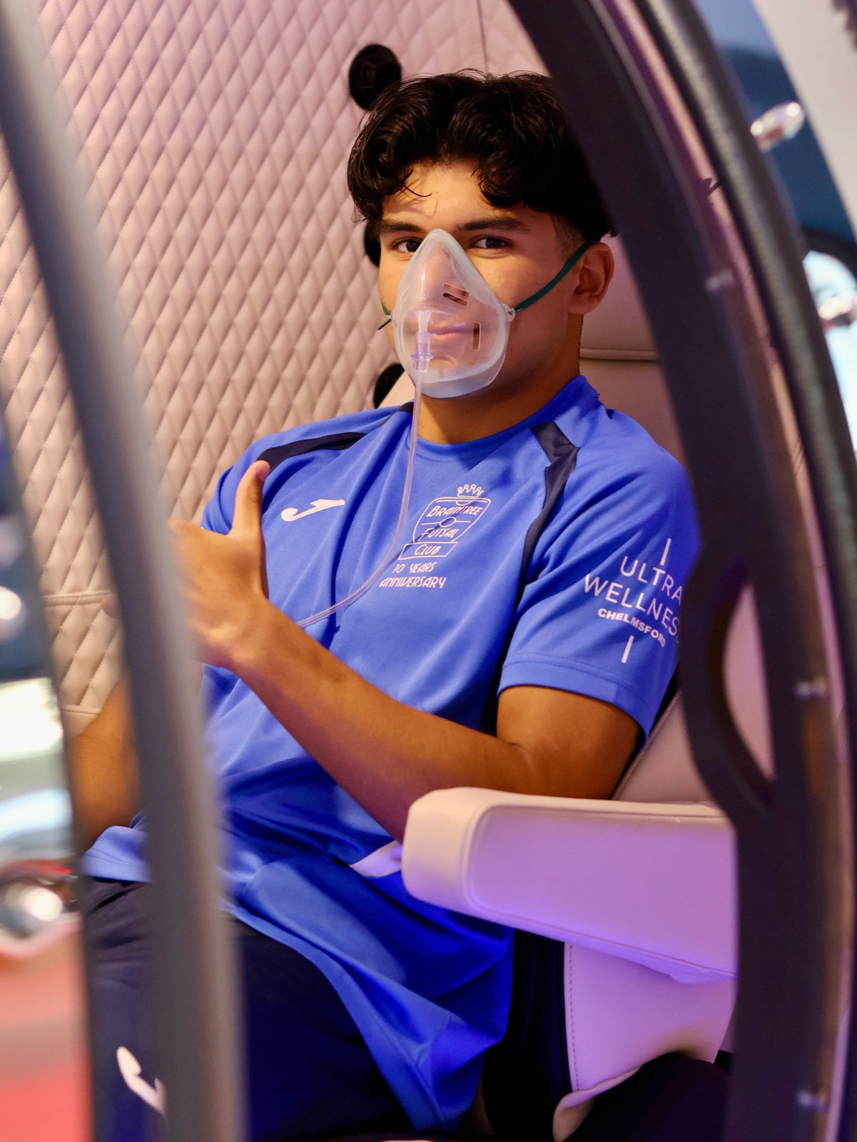 A Braintree Futsal Club player wearing the Ultra Wellness partner logo during a recovery visit in Chelmsford.